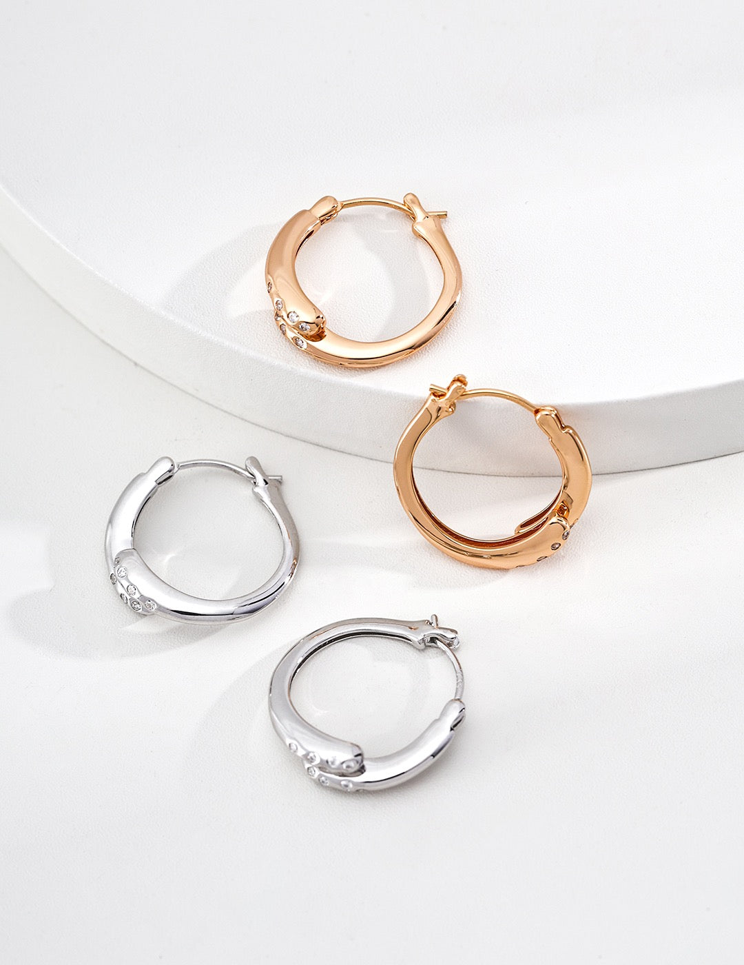 Gentle Resolve · Twisted Zirconia Gold Earrings